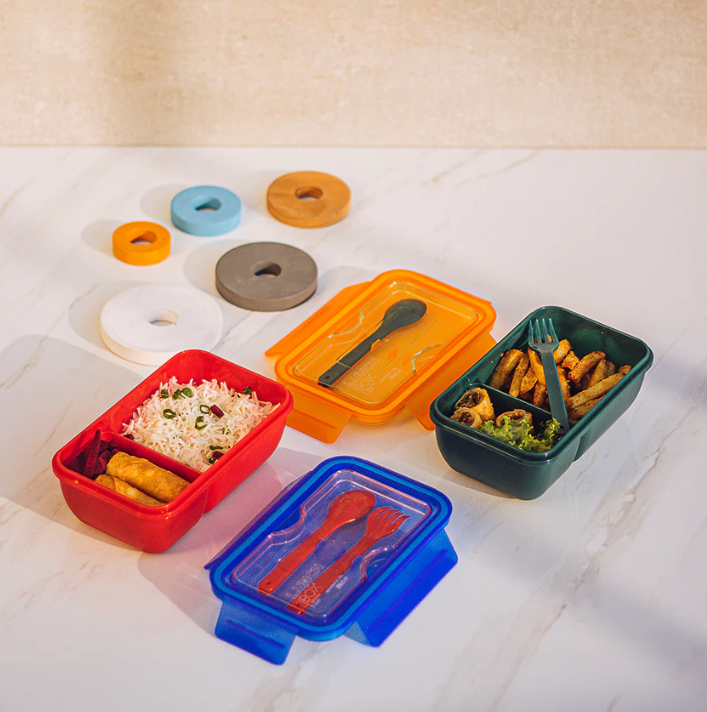 Kiddo kids lunch box open, showing two-tier compartments and utensils